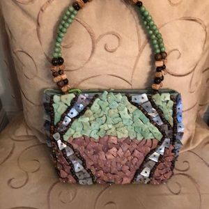 Stunning Pele turquoise/multicolor handbag.